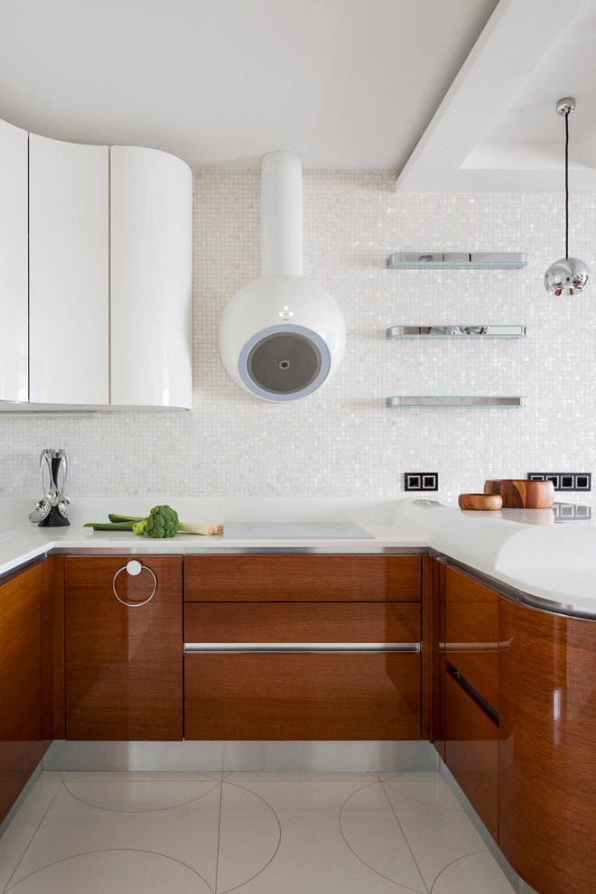 Photo of a contemporary u-shaped open plan kitchen in Moscow with flat-panel cabinets, medium wood cabinets, white splashback, mosaic tiled splashback and a breakfast bar.