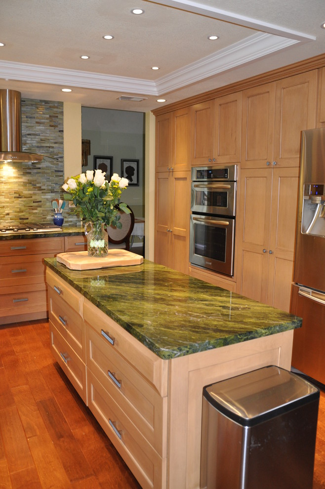 Trendy kitchen photo in San Diego with granite countertops, stainless steel appliances and green countertops