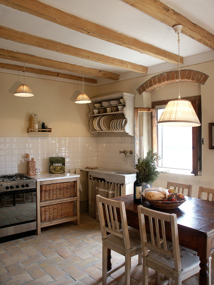 Eat-in kitchen - cottage eat-in kitchen idea in Atlanta with open cabinets and white backsplash