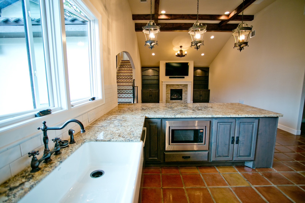 Design ideas for a large mediterranean kitchen in Houston with terracotta flooring.