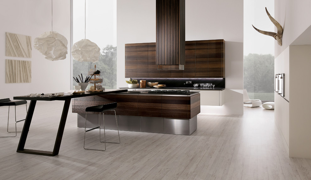Example of a mid-sized minimalist galley light wood floor eat-in kitchen design in Orange County with flat-panel cabinets, stainless steel cabinets, quartz countertops, stainless steel appliances and an island