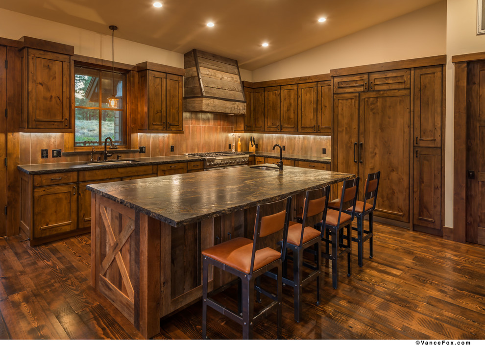Large rustic l-shaped kitchen in Sacramento with medium hardwood flooring and an island.