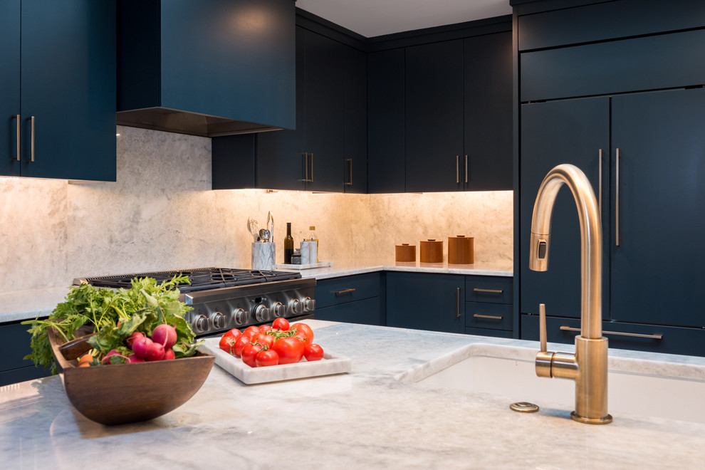 Medium sized classic l-shaped open plan kitchen in New York with a submerged sink, flat-panel cabinets, grey cabinets, granite worktops, white splashback, stone slab splashback, stainless steel appliances, ceramic flooring, an island and grey floors.