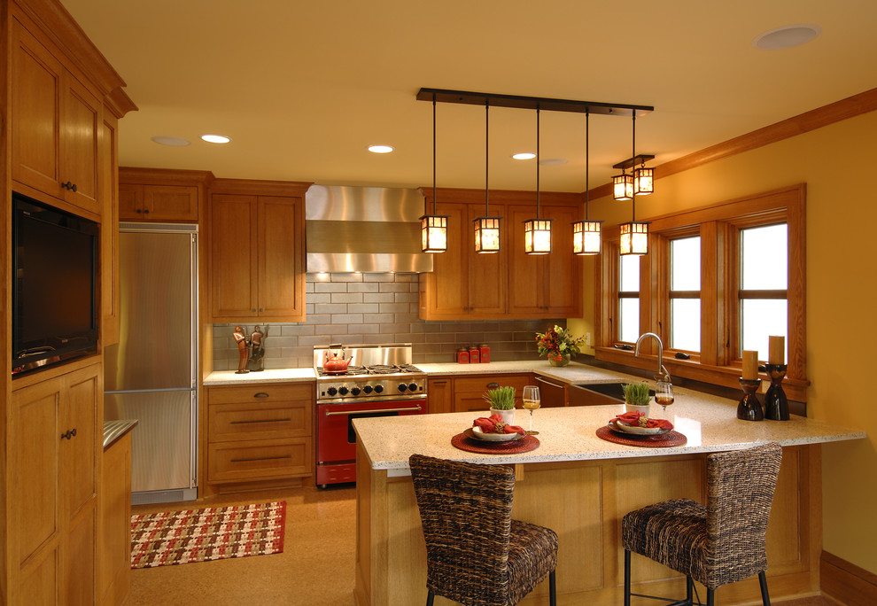 Example of a classic kitchen design in Minneapolis with stainless steel appliances and subway tile backsplash