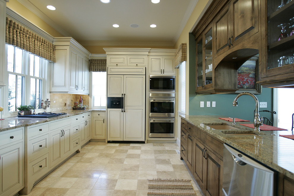 Kitchen - traditional kitchen idea in Minneapolis with glass-front cabinets and paneled appliances