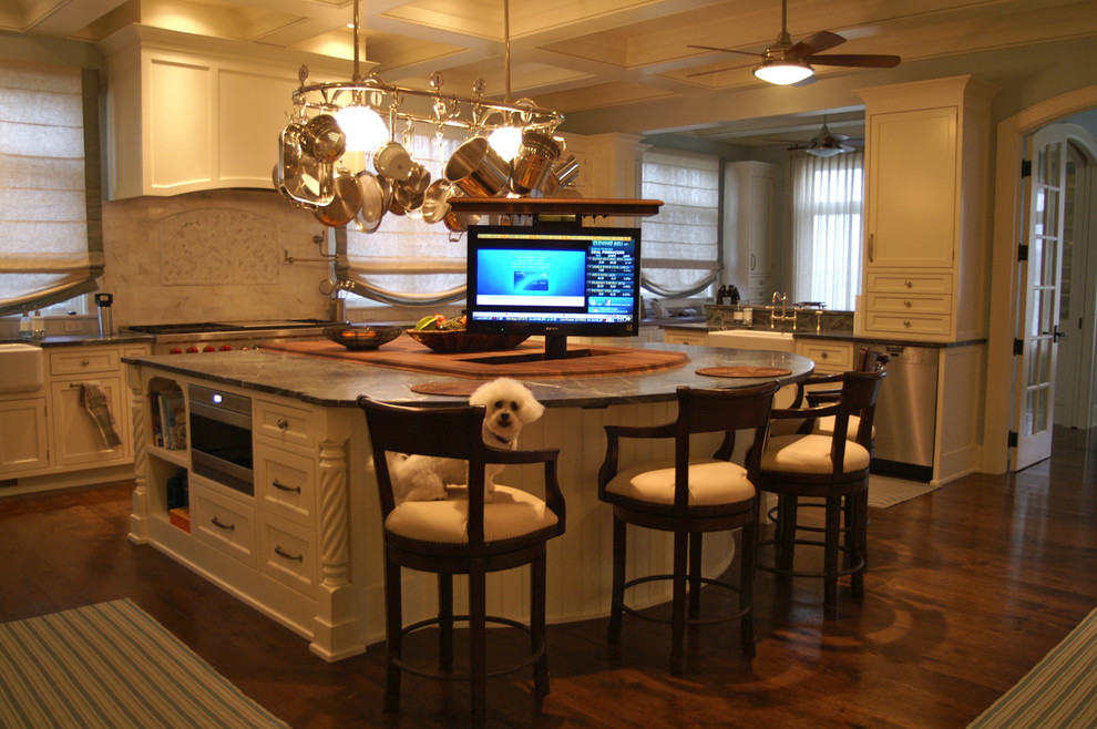 Example of a large classic u-shaped dark wood floor and brown floor open concept kitchen design in Milwaukee with beaded inset cabinets, white cabinets, granite countertops, a peninsula, a farmhouse sink, white backsplash, marble backsplash and stainless steel appliances