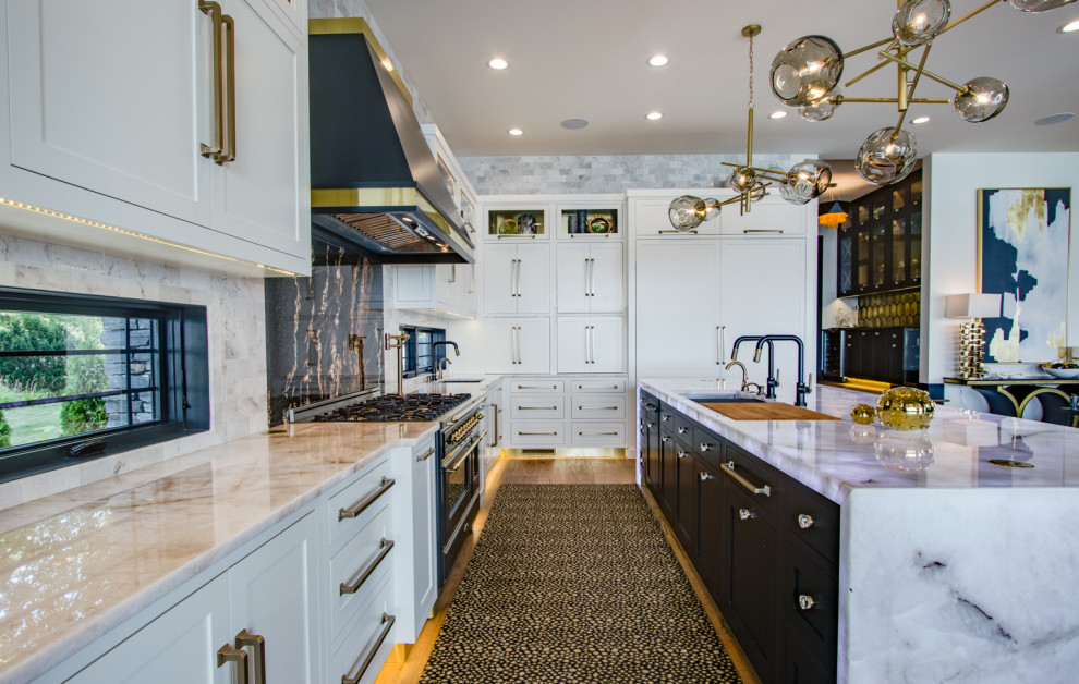 Photo of a large contemporary kitchen in Other with a submerged sink, shaker cabinets, white cabinets, granite worktops, white splashback, marble splashback, light hardwood flooring, an island and white worktops.