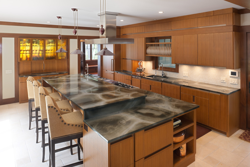 Inspiration for a large transitional l-shaped cement tile floor kitchen remodel in Chicago with an undermount sink, flat-panel cabinets, medium tone wood cabinets, white backsplash, mosaic tile backsplash, stainless steel appliances, an island and onyx countertops