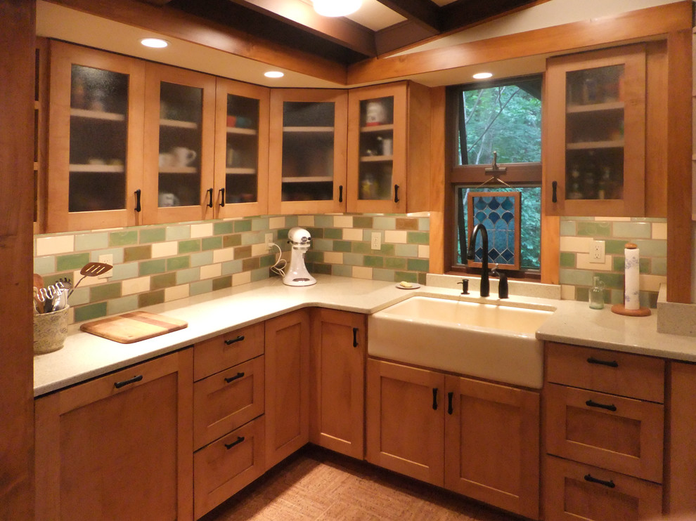 Mid-sized 1950s u-shaped cork floor open concept kitchen photo in Philadelphia with a farmhouse sink, flat-panel cabinets, light wood cabinets, quartz countertops, green backsplash, ceramic backsplash, paneled appliances and a peninsula