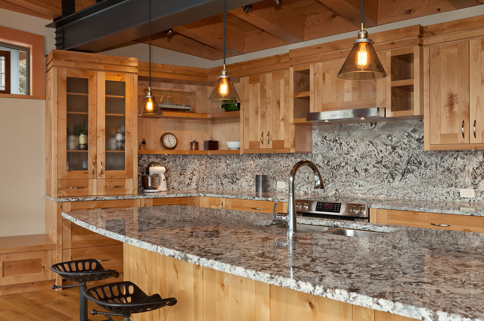 Example of a large trendy u-shaped medium tone wood floor open concept kitchen design in Vancouver with a double-bowl sink, shaker cabinets, medium tone wood cabinets, granite countertops, gray backsplash, stone slab backsplash, stainless steel appliances and an island