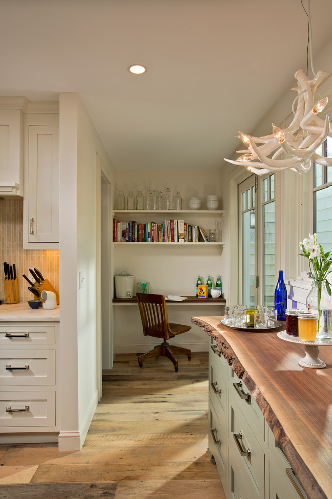 Small transitional l-shaped medium tone wood floor eat-in kitchen photo in Boston with a farmhouse sink, recessed-panel cabinets, dark wood cabinets, marble countertops, beige backsplash, matchstick tile backsplash and stainless steel appliances