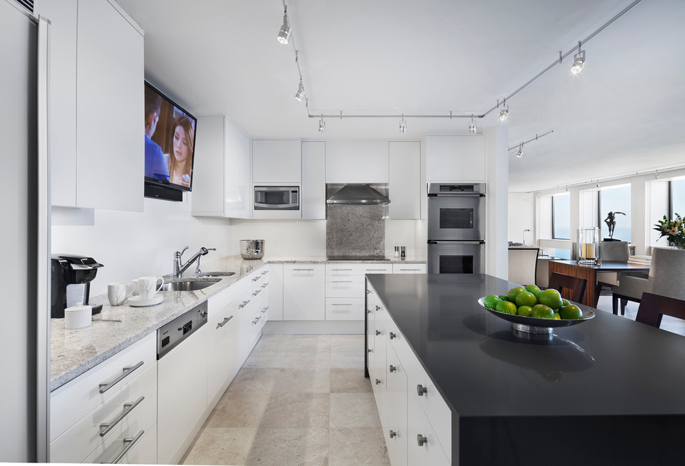 Trendy kitchen photo in Chicago with flat-panel cabinets, white cabinets, gray backsplash and stone slab backsplash