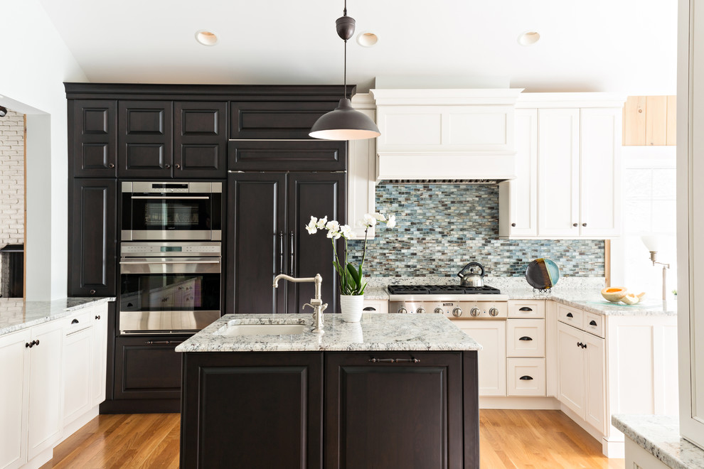 Large elegant kitchen photo in Boston with blue backsplash and an island