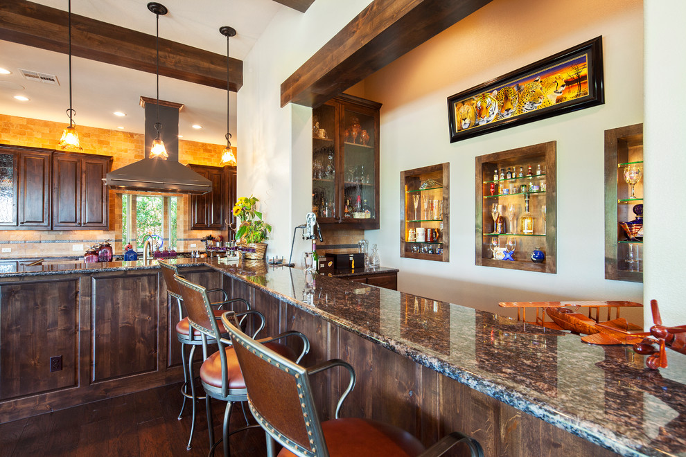 Inspiration for a timeless kitchen remodel in Austin with glass-front cabinets, dark wood cabinets, brown backsplash and granite countertops