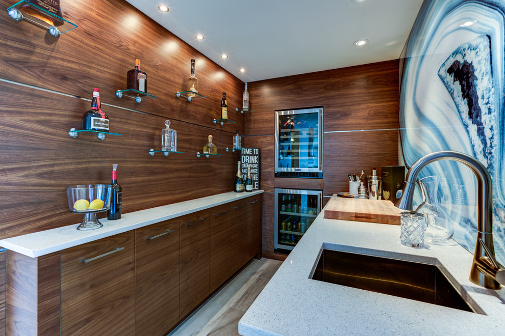 This is an example of a contemporary kitchen pantry in Vancouver with an integrated sink, flat-panel cabinets, medium wood cabinets, granite worktops, blue splashback, stainless steel appliances, medium hardwood flooring and an island.