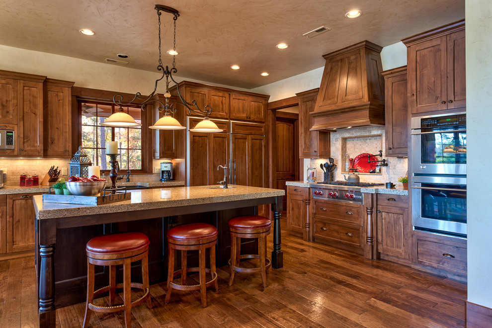 Example of a mountain style kitchen design in Other with stainless steel appliances