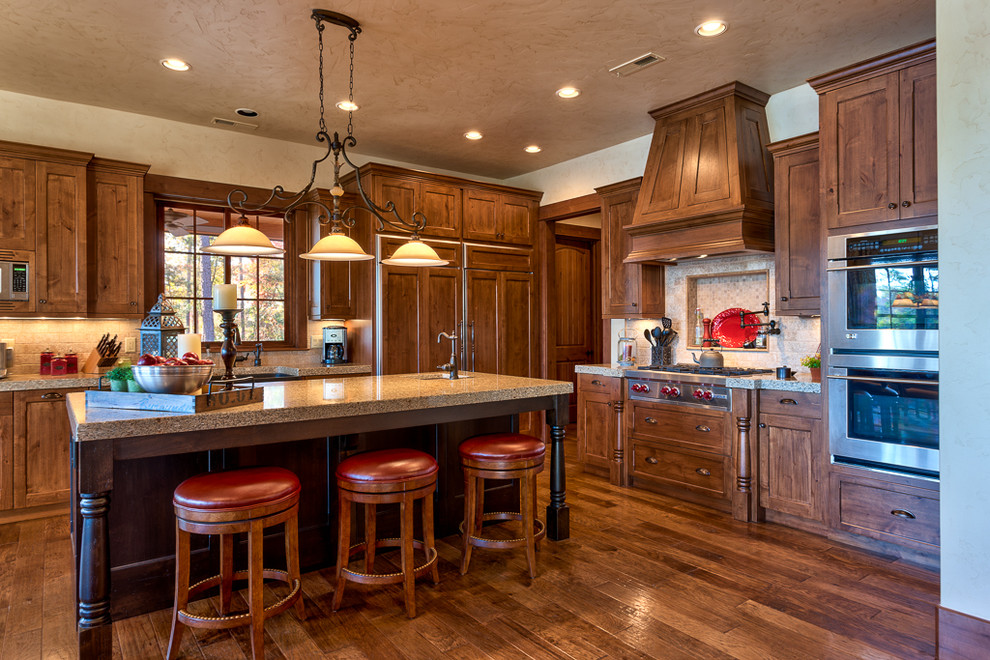 Photo of a rustic kitchen in Other with stainless steel appliances.