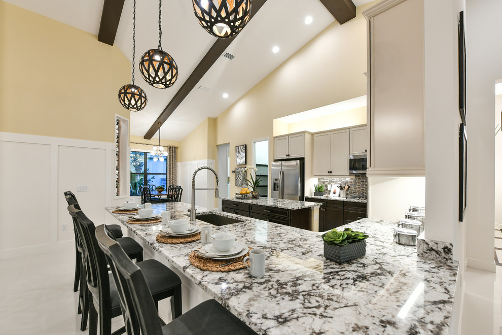 Design ideas for a large modern galley open plan kitchen in Other with a single-bowl sink, beaded cabinets, dark wood cabinets, stainless steel appliances and multiple islands.