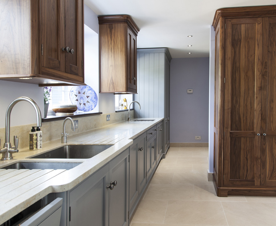 This is an example of an expansive contemporary kitchen in Essex with an island.