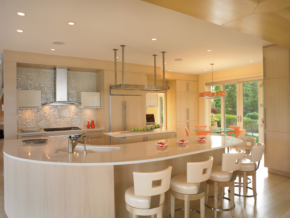 Photo of a contemporary kitchen in Cleveland with a submerged sink, flat-panel cabinets, light wood cabinets, metallic splashback, integrated appliances and light hardwood flooring.