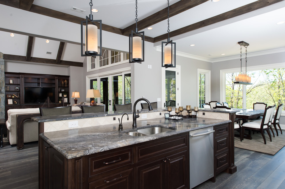 Example of a large transitional l-shaped dark wood floor open concept kitchen design in Other with raised-panel cabinets, white cabinets, granite countertops, multicolored backsplash, stone tile backsplash, stainless steel appliances, an island and an undermount sink