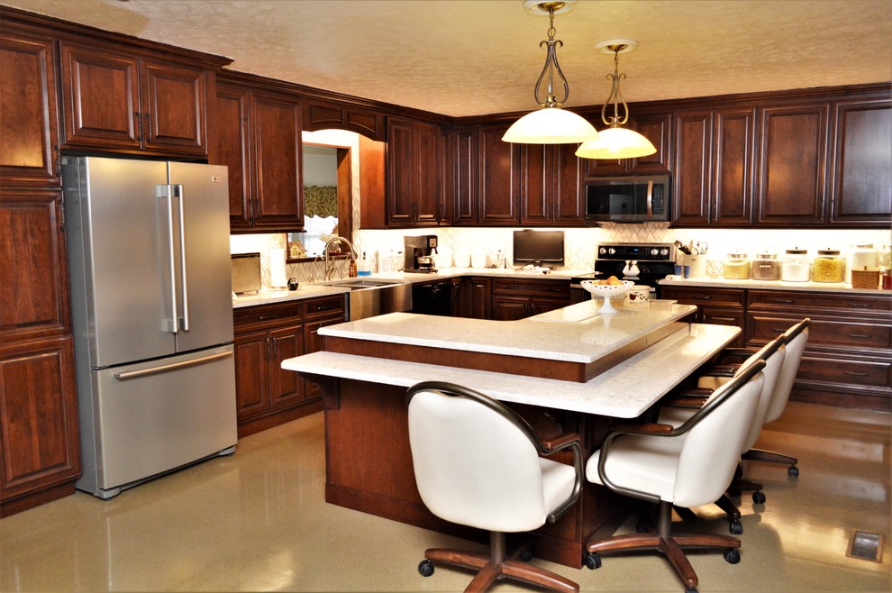 Eat-in kitchen - large traditional l-shaped eat-in kitchen idea in Other with a farmhouse sink, raised-panel cabinets, dark wood cabinets, quartzite countertops, white backsplash, ceramic backsplash, an island and white countertops