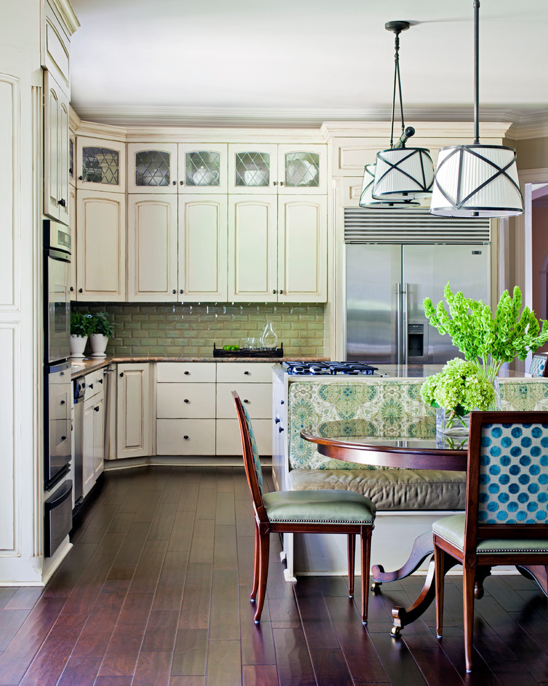Elegant dark wood floor and brown floor kitchen photo in Little Rock with stainless steel appliances