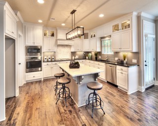 Gorgeous two story kitchen, granite countertops, pendant lighting, blue  mosaic backsplash tile, g…