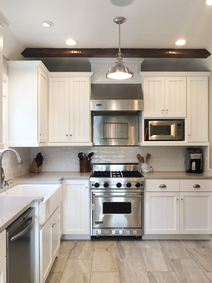 This is an example of a classic kitchen in Sacramento with white cabinets.
