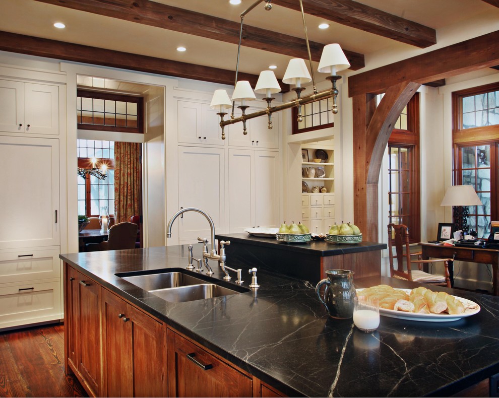 Mountain style kitchen photo in Atlanta with shaker cabinets, a double-bowl sink and soapstone countertops