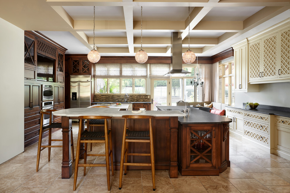Eat-in kitchen - huge eclectic l-shaped beige floor eat-in kitchen idea in Nashville with an undermount sink, glass-front cabinets, dark wood cabinets, marble countertops, multicolored backsplash, glass tile backsplash, stainless steel appliances and two islands