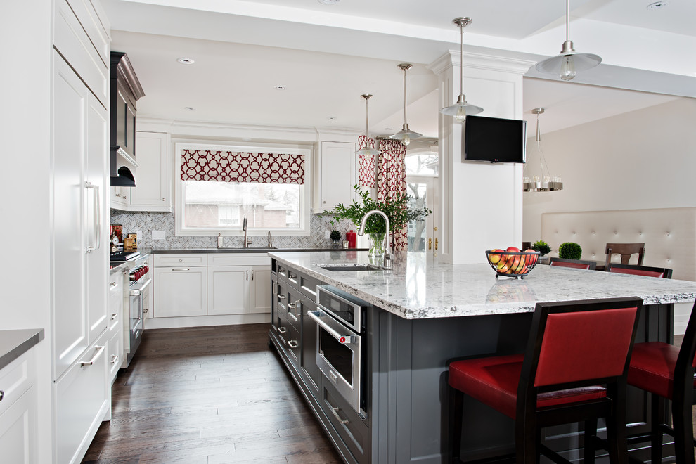 Example of a large transitional l-shaped medium tone wood floor eat-in kitchen design in Toronto with quartz countertops, gray backsplash, mosaic tile backsplash, paneled appliances, an island, white cabinets, beaded inset cabinets and an undermount sink