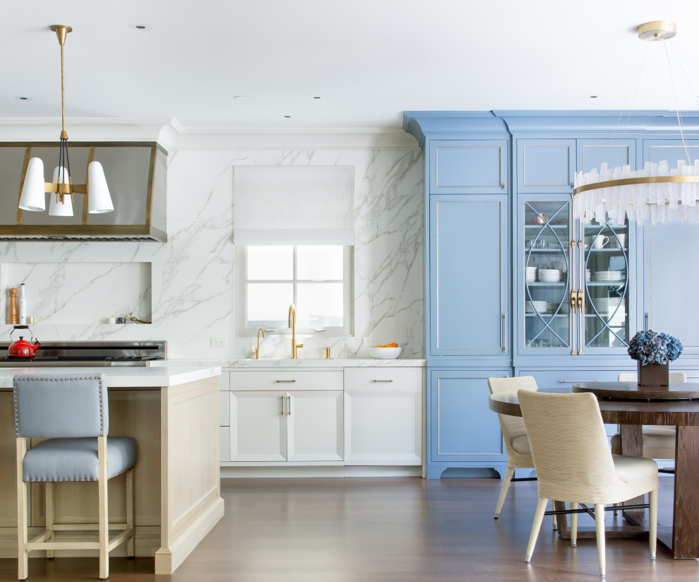 Eat-in kitchen - transitional galley dark wood floor and brown floor eat-in kitchen idea in San Francisco with an undermount sink, recessed-panel cabinets, white cabinets, white backsplash, stainless steel appliances, an island and white countertops