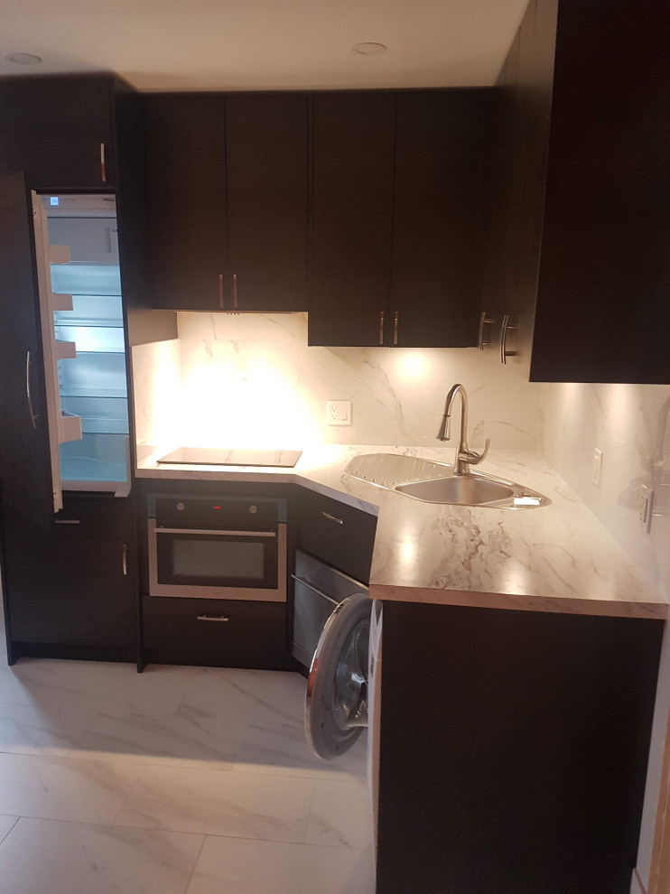 Small trendy l-shaped marble floor and white floor kitchen photo in Vancouver with a drop-in sink, flat-panel cabinets, dark wood cabinets, quartz countertops, white backsplash, stone slab backsplash, stainless steel appliances and white countertops