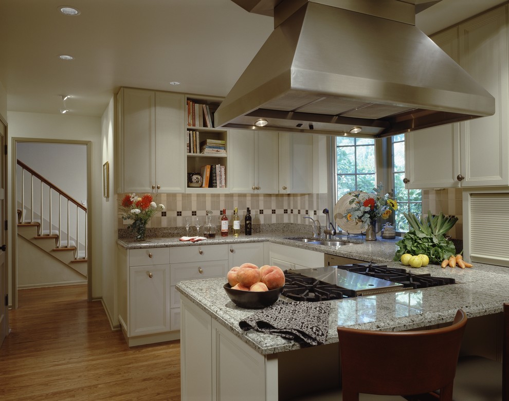 Elegant kitchen photo in Seattle with recessed-panel cabinets and white cabinets