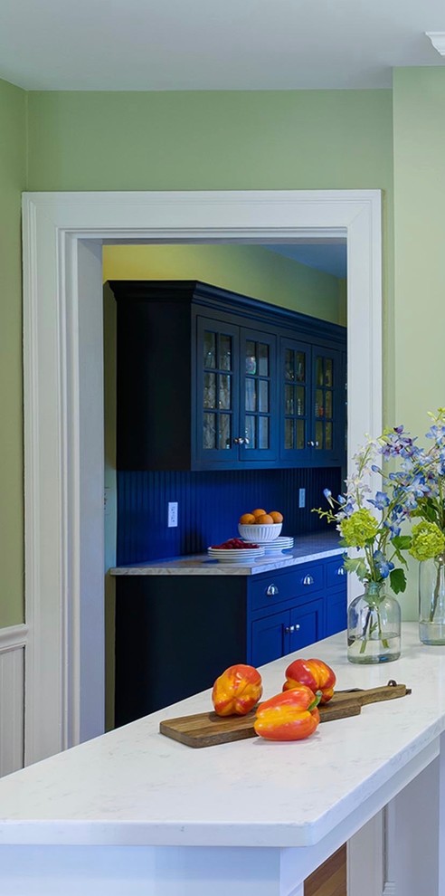Enclosed kitchen - small enclosed kitchen idea in Boston with flat-panel cabinets and blue cabinets