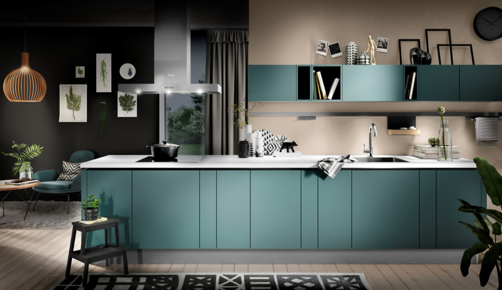 Inspiration for a small modern single-wall kitchen/diner in Calgary with a single-bowl sink, flat-panel cabinets, turquoise cabinets, quartz worktops, light hardwood flooring, no island, beige floors and white worktops.