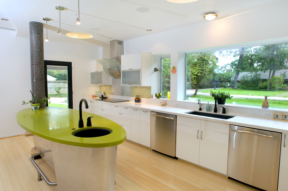 Kitchen - eclectic kitchen idea in Houston with stainless steel appliances, an undermount sink, flat-panel cabinets, white cabinets, quartz countertops and green countertops