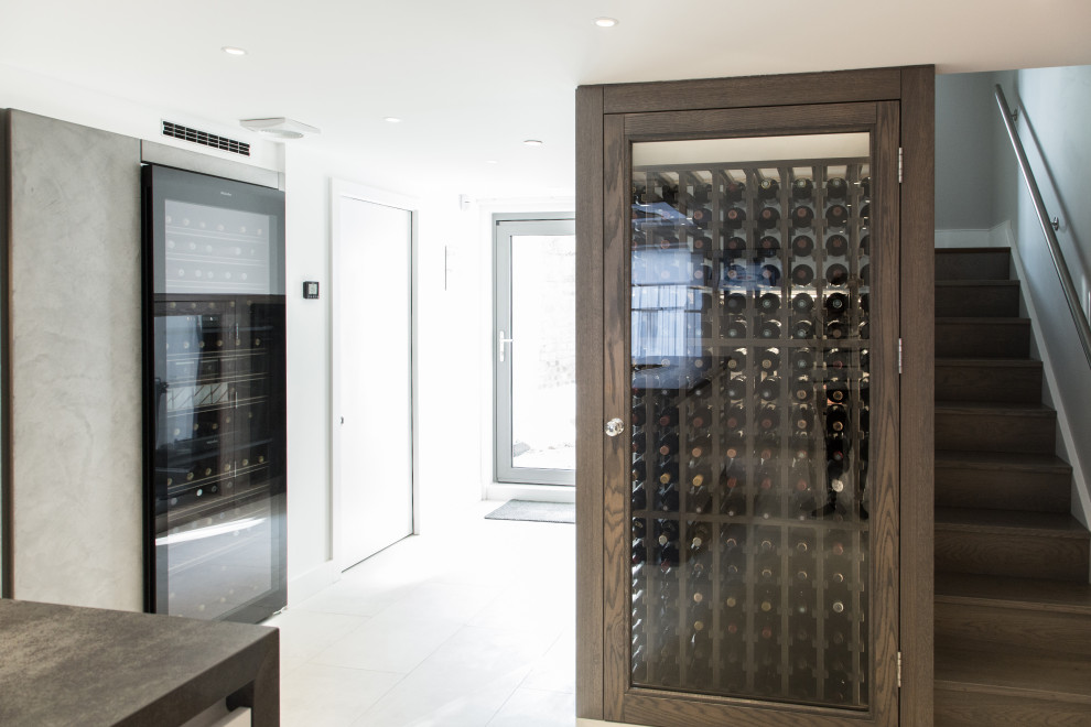 Example of a mid-sized trendy wine cellar design in London