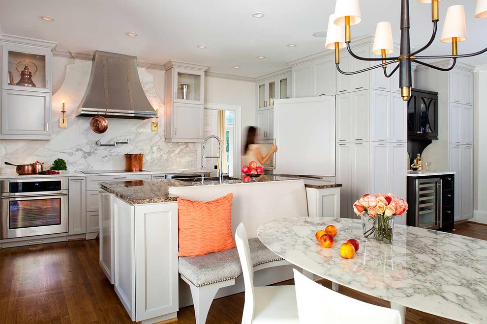 Transitional u-shaped eat-in kitchen photo in Atlanta with an undermount sink, recessed-panel cabinets, white cabinets, white backsplash and paneled appliances