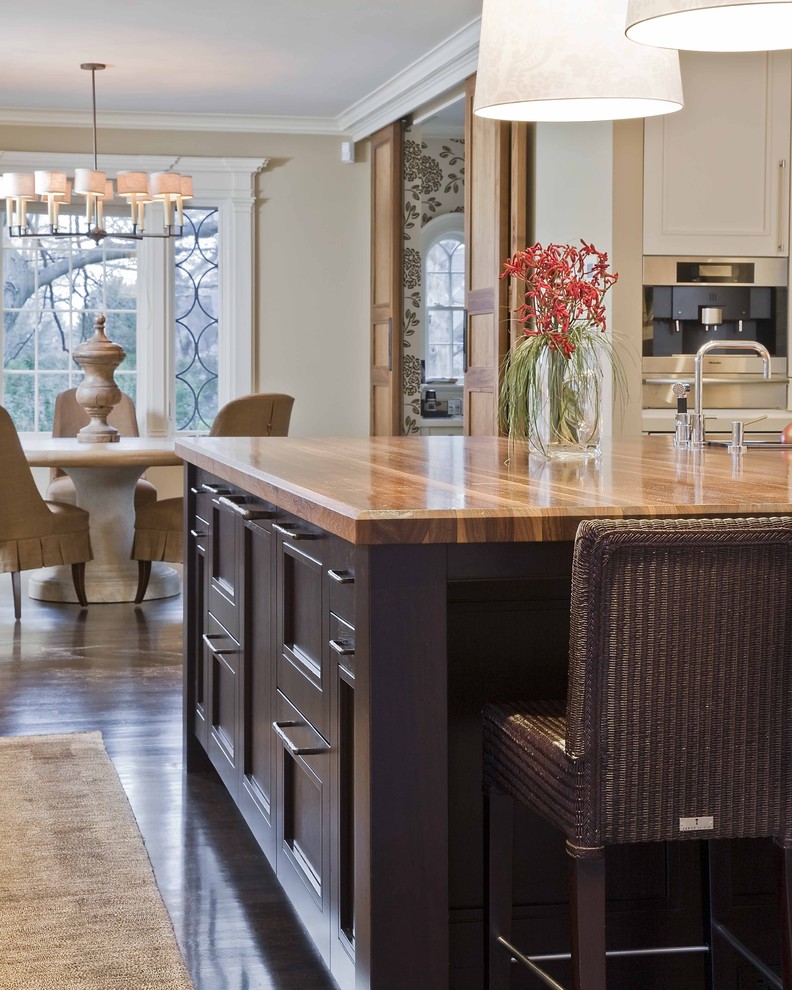 Inspiration for a timeless eat-in kitchen remodel in Boston with wood countertops