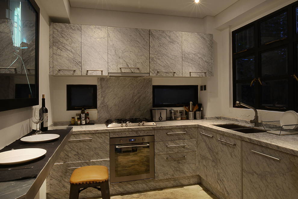 Zen concrete floor and gray floor kitchen photo in Hong Kong with a single-bowl sink, flat-panel cabinets, marble countertops, marble backsplash and stainless steel appliances