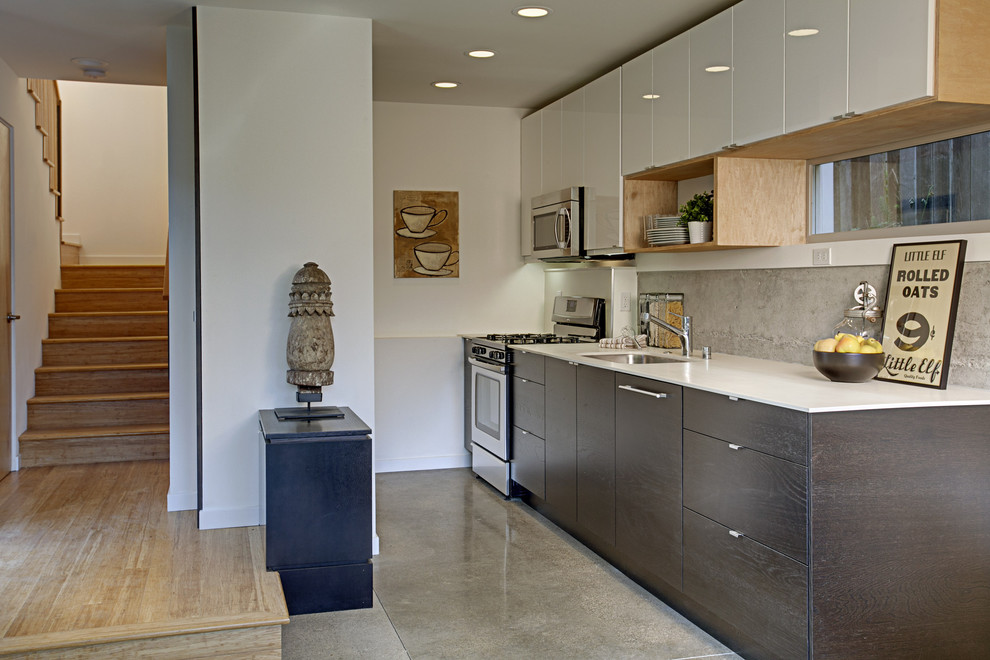 Example of a minimalist kitchen design in Seattle with stainless steel appliances