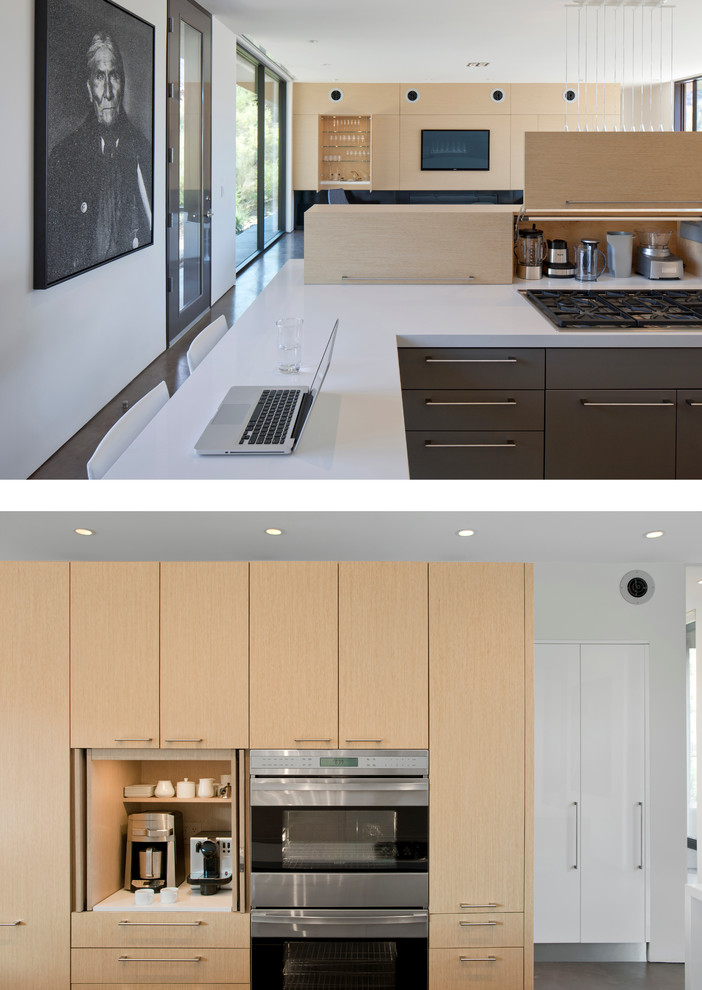 На фото: кухня в современном стиле с плоскими фасадами, бетонным полом и столешницей из кварцевого агломерата
