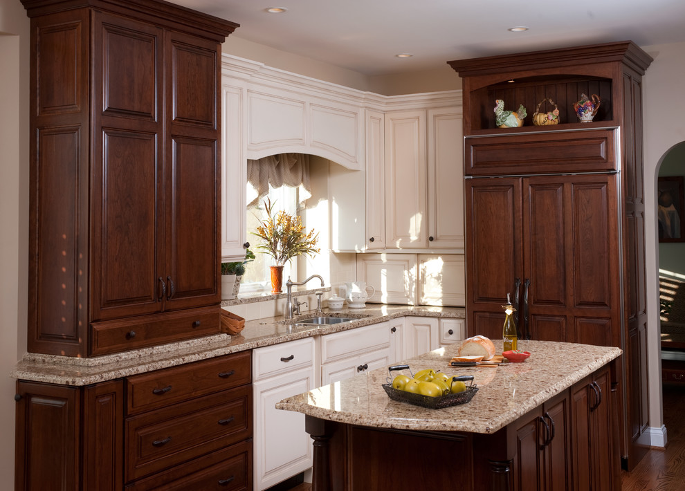 Example of a classic u-shaped eat-in kitchen design in Chicago with a single-bowl sink, raised-panel cabinets, white cabinets, granite countertops, white backsplash, ceramic backsplash and stainless steel appliances
