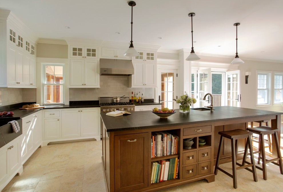 Kitchen - traditional kitchen idea in Boston with a farmhouse sink and soapstone countertops