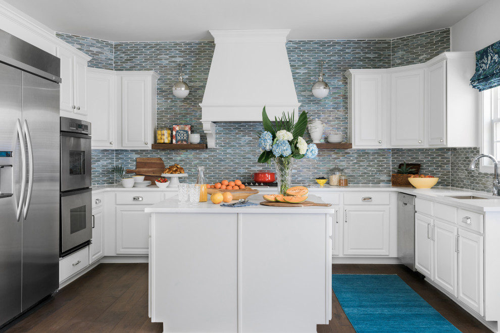 Inspiration for a timeless u-shaped dark wood floor kitchen remodel in Atlanta with an undermount sink, raised-panel cabinets, white cabinets, multicolored backsplash, stainless steel appliances, an island and white countertops