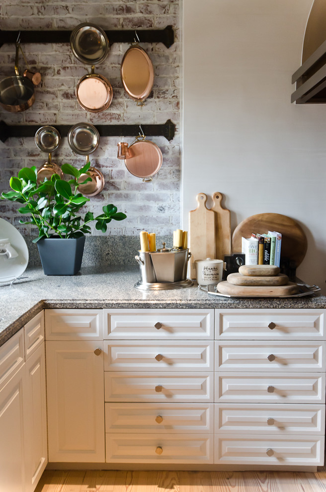 Inspiration for a timeless kitchen remodel in San Francisco with raised-panel cabinets and white cabinets