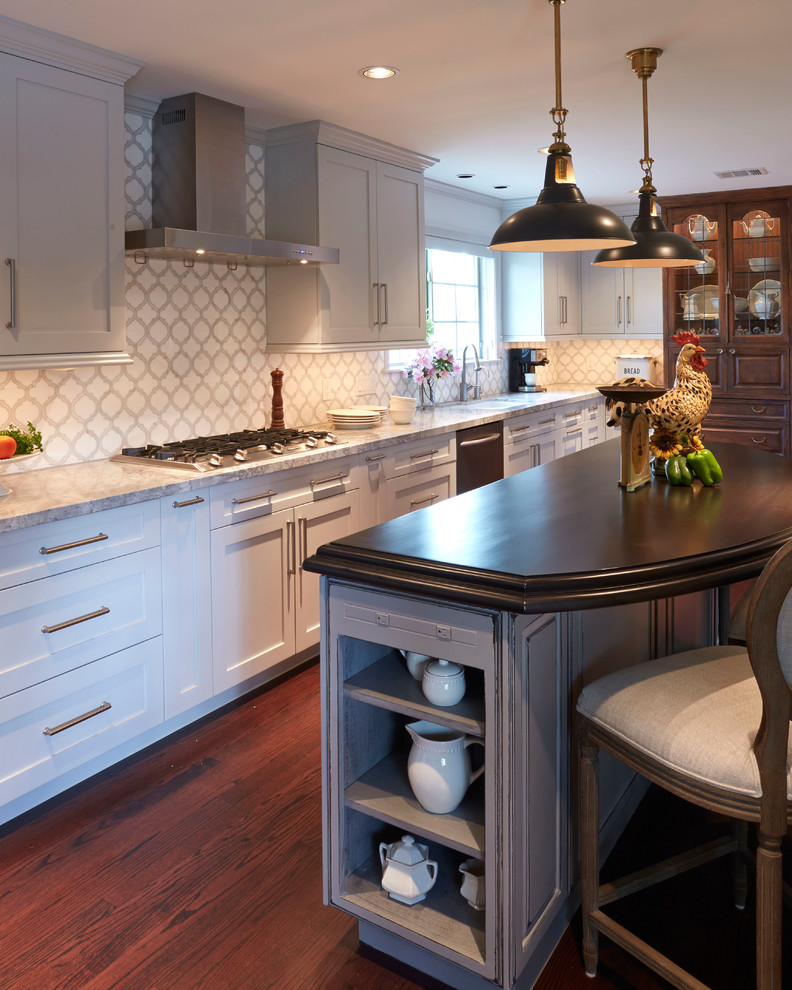 Design ideas for a large rural l-shaped enclosed kitchen in Houston with a double-bowl sink, shaker cabinets, white cabinets, quartz worktops, white splashback, porcelain splashback, stainless steel appliances, dark hardwood flooring and an island.