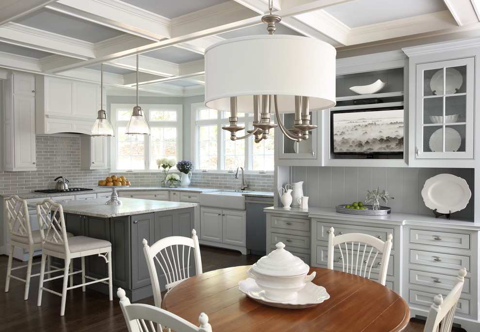 Eat-in kitchen - mid-sized traditional l-shaped dark wood floor eat-in kitchen idea in Atlanta with a farmhouse sink, shaker cabinets, white cabinets, granite countertops, gray backsplash, subway tile backsplash, stainless steel appliances and an island